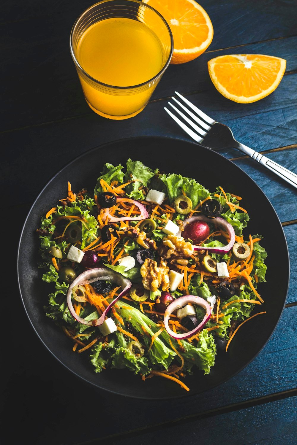 Fresh salad on a dark plate